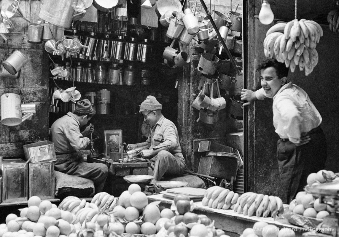 Tinsmith and fruit stall, Tripoli market, 1960.