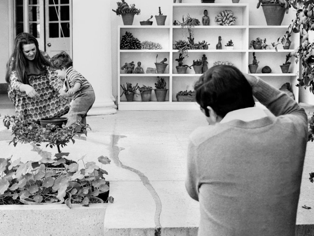 Rajiv Gandhi, son of Indira Gandhi, on visit to Number 1 Safdarjung Road, New Delhi, 1972.
‘Rajiv Gandhi was a very good amateur photographer. Here he is photographing his wife Sonia and their son Rahul’.
